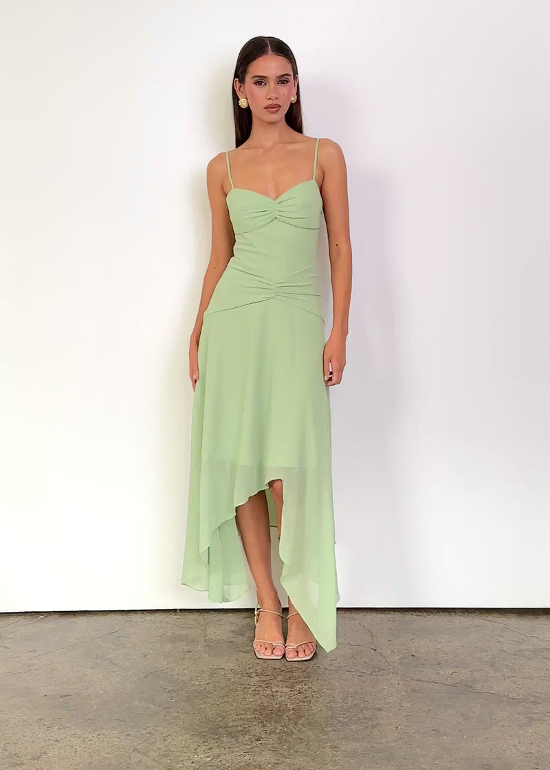 Video: Lauralee Midi Dress in Mint Green, featuring a sweetheart neckline, thin shoulder straps, gathered bust and waist detailing, and a flowing asymmetric midi hem.