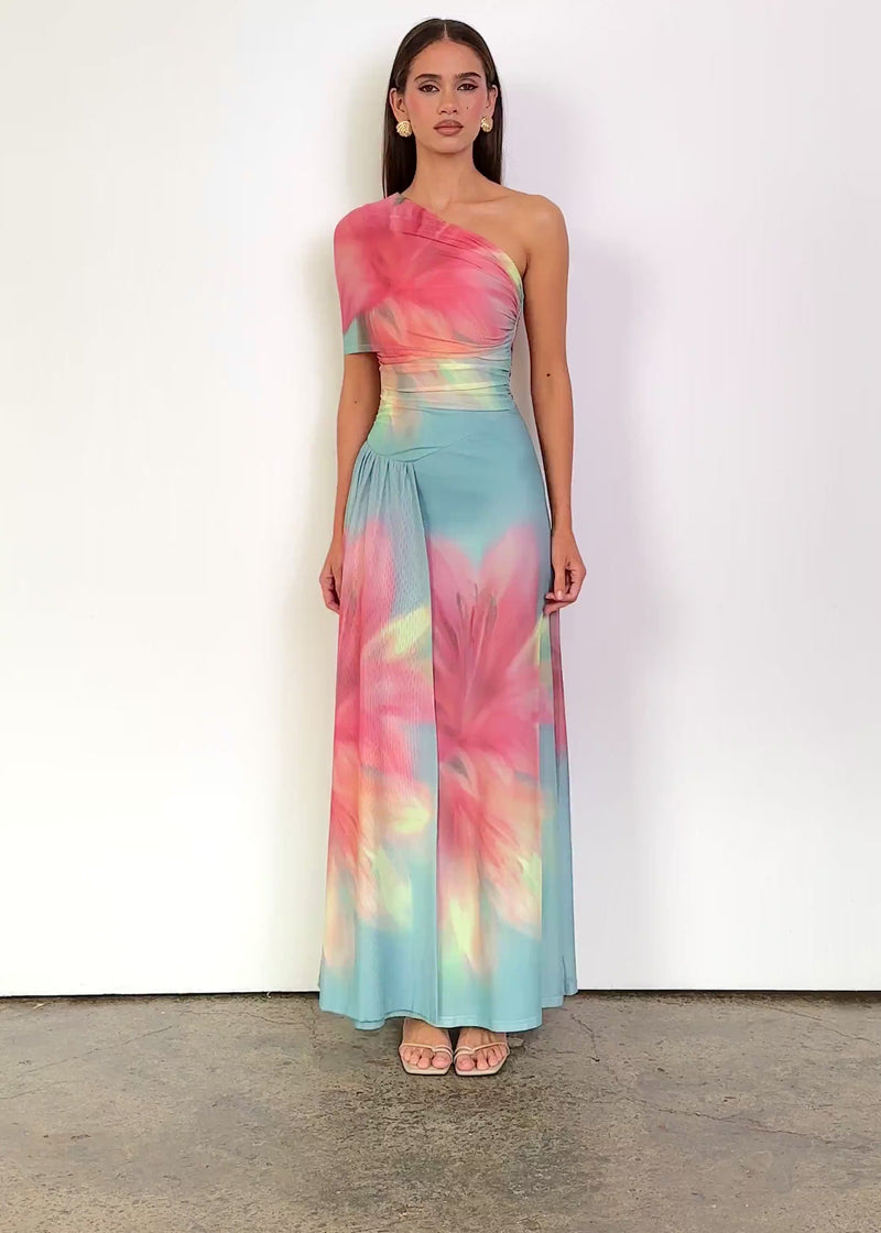 Video: Luah One Shoulder Mesh Maxi Dress in Aqua Pink Bloom, featuring an asymmetric one-shoulder neckline, draped short sleeve, ruched fitted bodice and a flowing maxi silhouette with side drape detailing in a vibrant floral print.